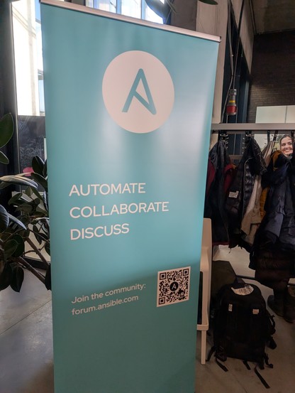 Ansible banner with message: "Automate, collaborate, discuss. Join the community: forum.ansible.com"