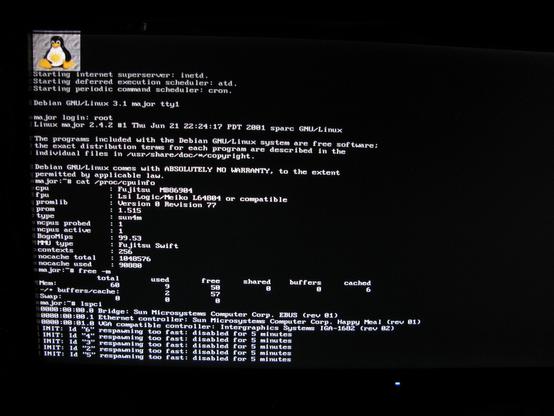 A Linux text console boot on a SPARC, debian 3.1 login, showing lscpu, lspci and free -m.   A Tux with a yellow sun on his belly shines down from the top corner