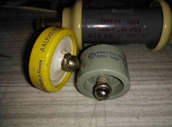 Three chunky high voltage capacitors; one 10kV 1000pF chunky beast at the back (UK made), a round yellow smaller one at the side from France and at the front a russsian 150nF 10kV (?)