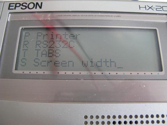 The small screen of an Epson HX-20 showing Intext's Init menu:
P Printer
R RS232C
T TABS
S Screen width