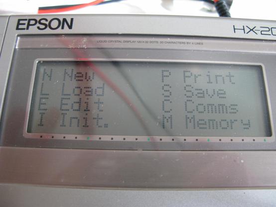 The small screen of the Epson HX-20 showing Intext's main Menu:
N New     P Print
L Load    S Save
E Edit  C Comms
I Init.  M Memory
