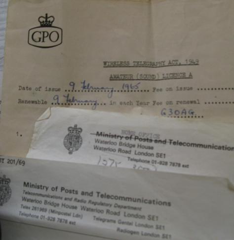 a ~1965 amateur radio license for my dad, G3OAG; showing the GPO header, then on top the header of a letter from the Ministry of Posts and Telecommunications (crossed out to Home Office) and then below that another one which is Ministry of Posts and Telecommunications.