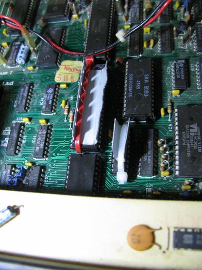 A picture of my Beeb now with bodged bent mettle heatsinks on the 6502 and neighbouring 245.  Held on vaguely by wireties.