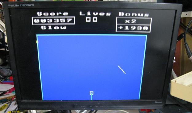 A blurry screen shot of the game 'frenzy' on a modern LCD monitor; it's blurry because the monitor doesn't like interlace. The play area is a rectangle and you draw boxes to try and trap a moving line;  it's basically a clone of QIX.