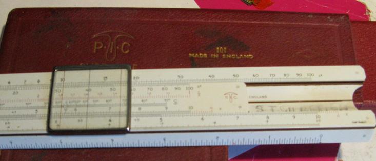 A slide rule, with my dads name written on the inside of the slide.
It's got various scales on (including x^2 and 1/x) and has a nice red box for it to go in.