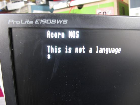 Hmm, 'Acorn MOS  This is not a language   *'  in Mode 0