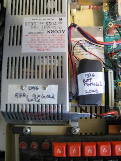 The inside of my Master; I've labelled the PSU with 'DAG   RIFA Replaced 2026'
and I've put a new battery pack in and labelled it to say it was replaced in 2026.  It's a 2x2 AA battery pack wrapped in heatshrink.