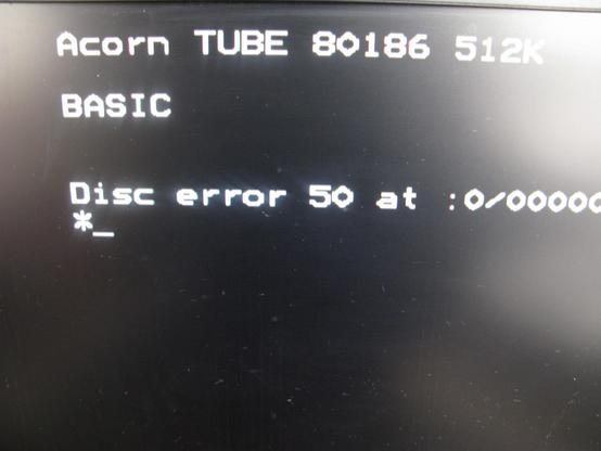 A screen shot showing 'Acorn TUBE 80186 512K' 'BASIC' and then a Disc error