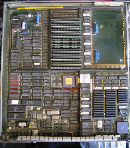 A Sun3 mainboard - at the back there are 24 SIMM slots, 20 of them are filled with 1MB simms  It's big - it drawfs the 68020 in the middle.  To the bottom right is the graphics card.
