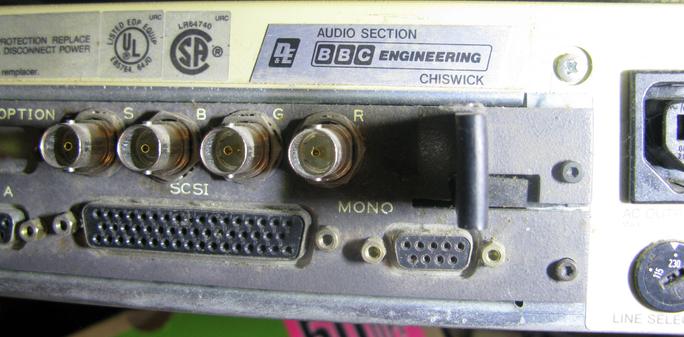 The other side of hte back showing the video sockets an unusual huge (68pin?) D scsi, and a 'BBC Engineering chiswick - Audio section' sticker.